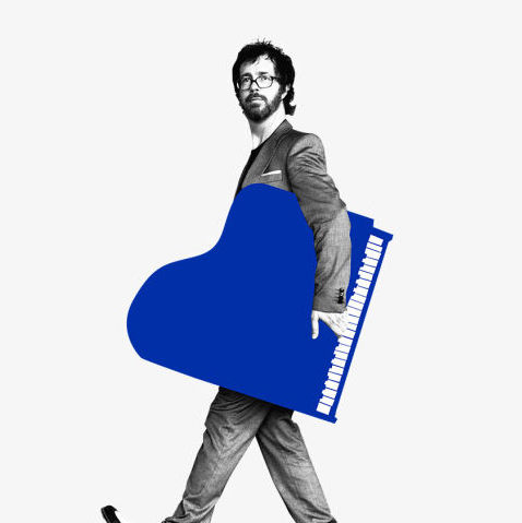Ben Folds holding piano